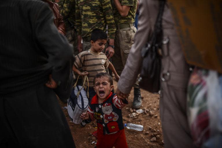 Tens of thousands of Syrian Kurds flooded across the border into Turkey to flee an onslaught by Islamic State militants in September 2014