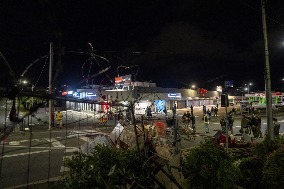 FILE- Residents stand in a blockade in Noumea, New Caledonia, on May, 15, 2024. Global nickel prices have soared since deadly violence erupted in the French Pacific territory of New Caledonia. (AP Photo/Nicolas Job, File)