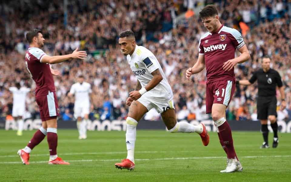 Leeds United's Brazilian midfielder Raphinha Dias Belloli celebrates scoring his team's first goal during the English Premier League football match between Leeds United and West Ham United at Elland Road in Leeds, northern England on September 25, 2021. - GETTY IMAGES