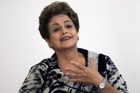 Brazil's President Dilma Rousseff reacts during the ceremony to sign a Provisional Measure of Policy Wage Minimum, at the Planalto Palace in Brasilia March 24, 2015. REUTERS/Ueslei Marcelino