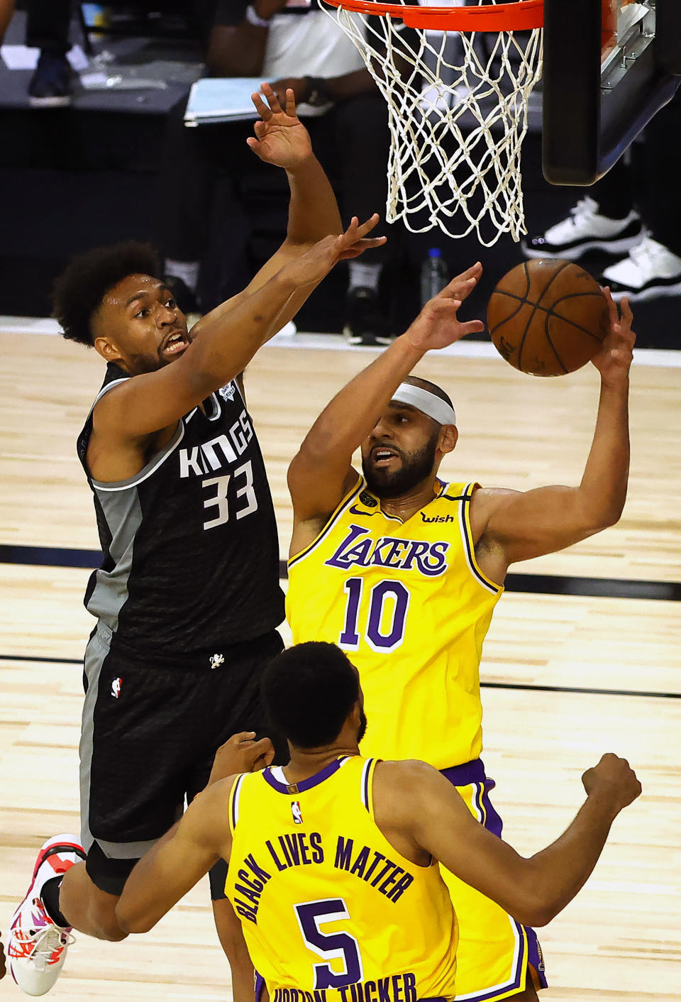 Los Angeles Lakers' Jared Dudley (10) goes up for a shot against Sacramento Kings' Jabari Parker (33) during the second quarter of an NBA basketball game Thursday, Aug. 13, 2020, in Lake Buena Vista, Fla. (Kevin C. Cox/Pool Photo via AP)