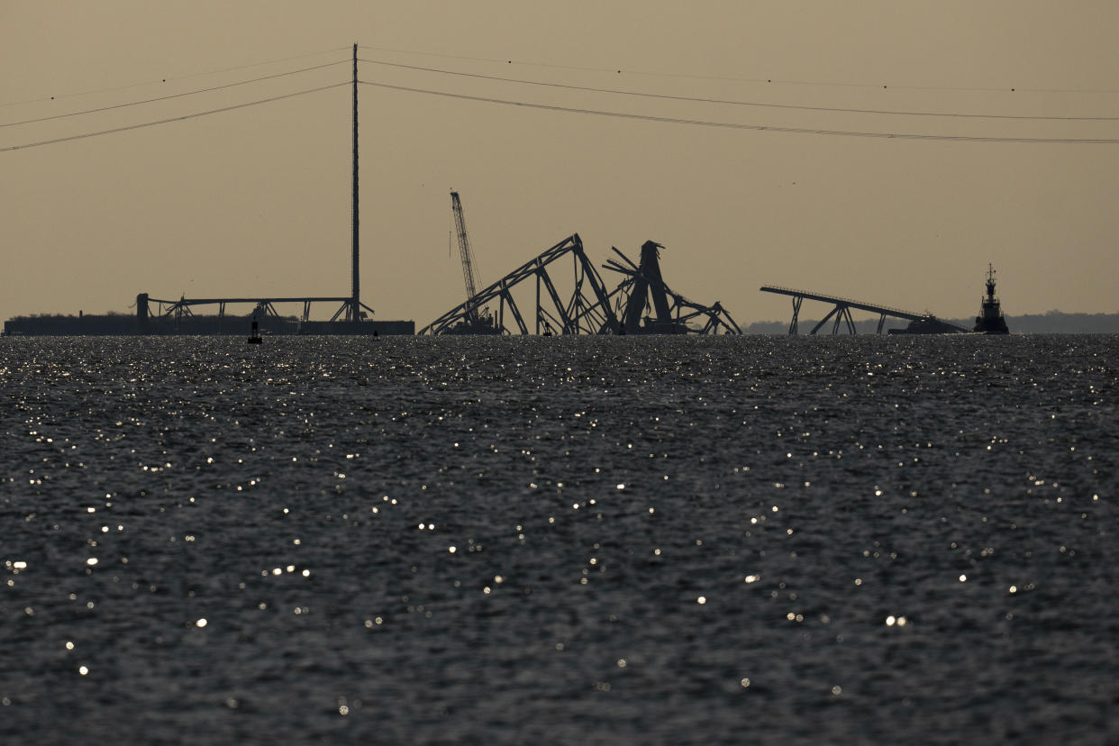 A crane on a barge works at the collapsed Francis Scott Key Bridge in Baltimore, Md., March 29, 2024. (Erin Schaff/The New York Times)