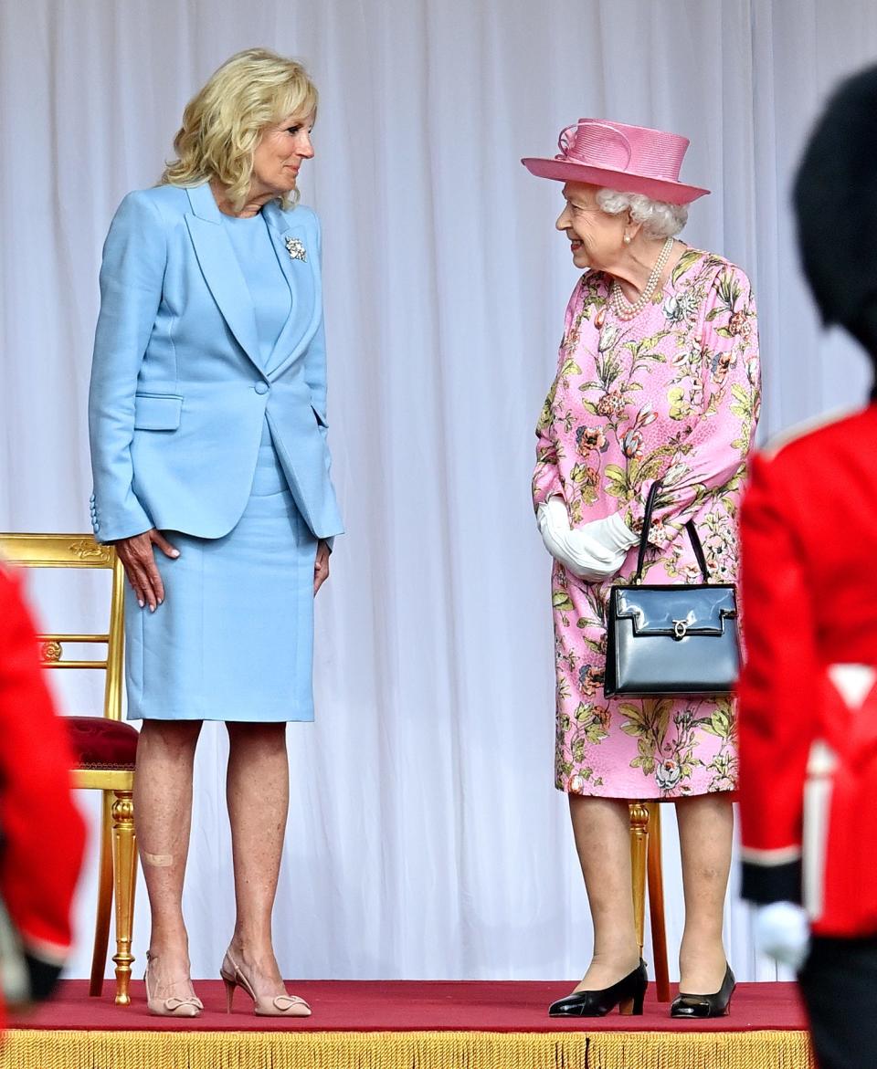 Jill Biden talks with Queen Elizabeth II during her and U.S. President Joe Biden's ceremonial welcome at Windsor Castle on June 13, 2021