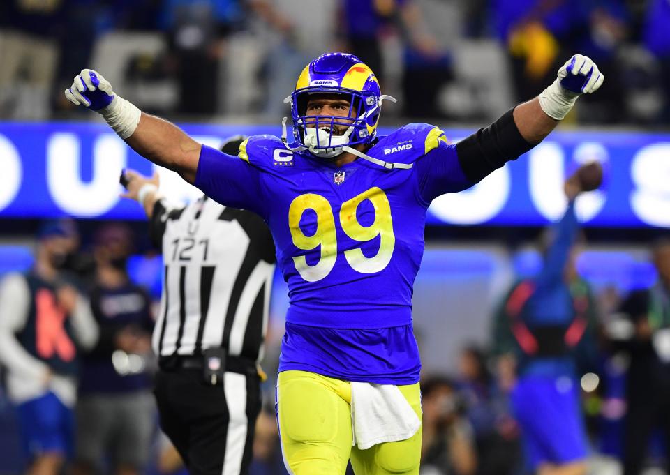 Los Angeles Rams defensive end Aaron Donald (99) celebrates in the fourth quarter during the NFC Championship Game against the San Francisco 49ers at SoFi Stadium.