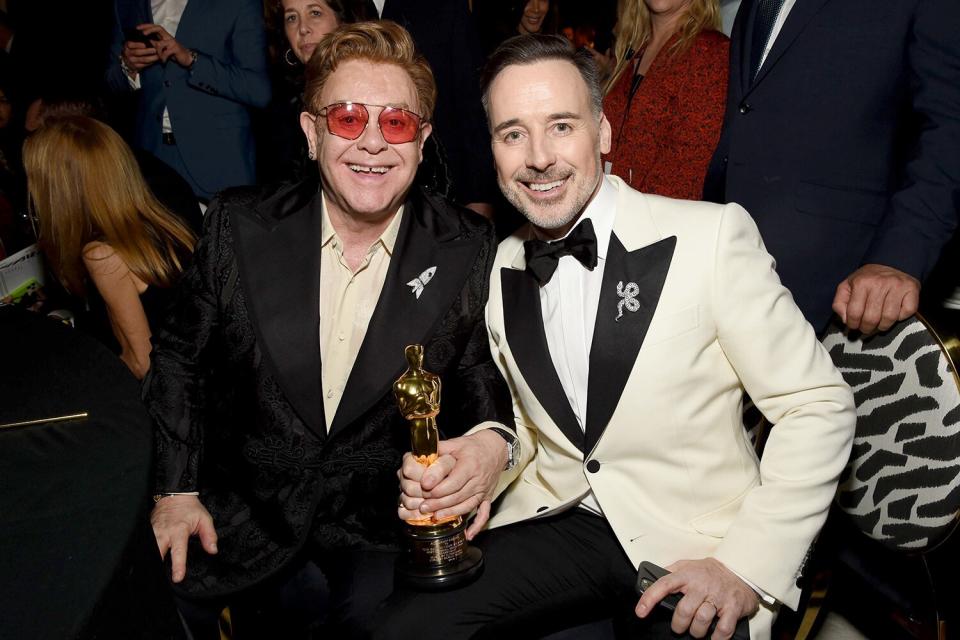 Elton John and David Furnish celebrate Elton's Best Original Song win at his Annual Oscars Viewing Party. 