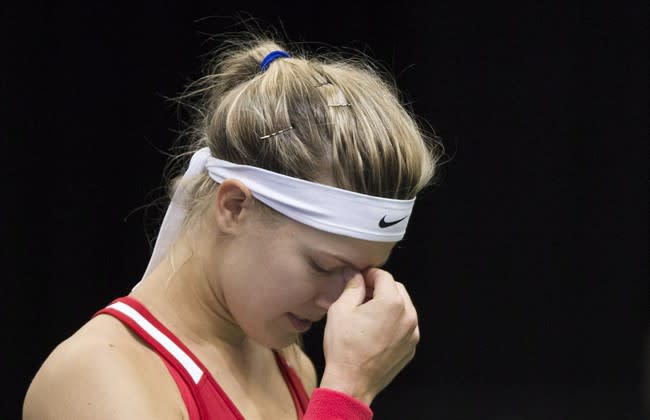 Canada's Eugenie Bouchard reacts during her Federal Cup tennis match against Romania&#39;s Alexandra Dulgheru in Montreal, Saturday, April 18, 2015. THE CANADIAN PRESS/Graham Hughes