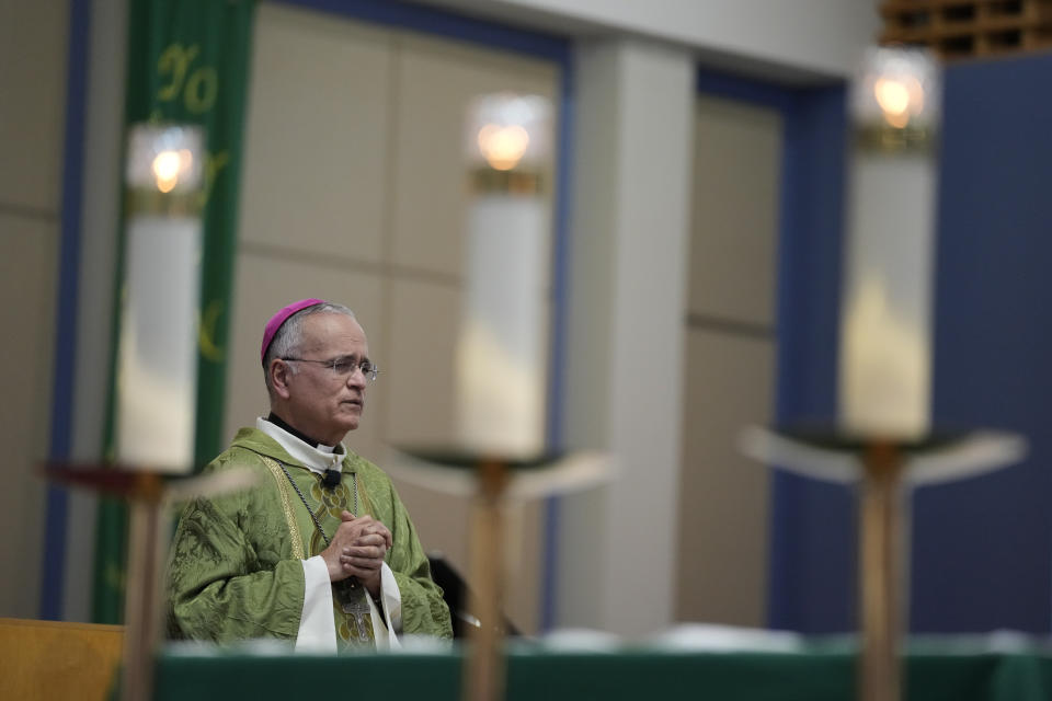 Rev. Silvio Baez, auxiliary bishop of Managua, Nicaragua, performs Mass at St. Agatha Catholic Church, which has become the spiritual home of the growing Nicaraguan diaspora, Sunday, Nov. 5, 2023, in Miami. For Baez, one of his concelebrant priests and many in the pews who have had to flee or were exiled from Nicaragua recently, the Sunday afternoon Mass at the Miami parish is not only a way to find solace in community, but also to keep pushing back against the Ortega regime's violent suppression of all critics, including many Catholic leaders. (AP Photo/Rebecca Blackwell)