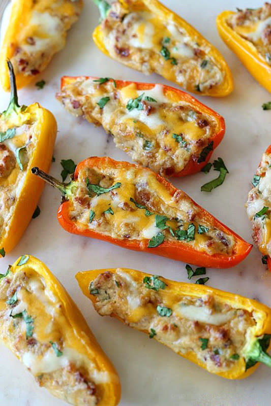 <p>Belle of the Kitchen</p><p>These mini pepper bites have two kinds of cheese, bacon, and more, are get baked to melty deliciousness.</p><p><strong>Get the recipe: </strong><a href="https://belleofthekitchen.com/2016/02/26/cheesy-bacon-stuffed-mini-peppers/" rel="nofollow noopener" target="_blank" data-ylk="slk:Cheesy Bacon Stuffed Mini Peppers;elm:context_link;itc:0;sec:content-canvas" class="link "><strong>Cheesy Bacon Stuffed Mini Peppers</strong></a></p>
