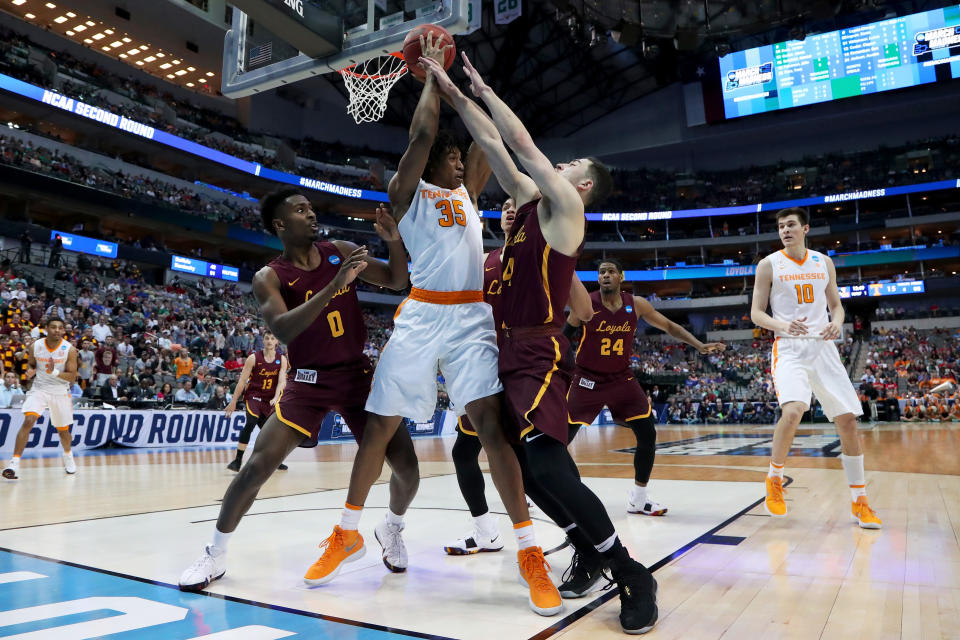 <p>Yves Pons #35 of the Tennessee Volunteers handles the ball while being pressured by Donte Ingram #0 and Ben Richardson #14 of the Loyola Ramblers in the first half during the second round of the 2018 NCAA Tournament at the American Airlines Center on March 17, 2018 in Dallas, Texas. (Photo by Tom Pennington/Getty Images) </p>
