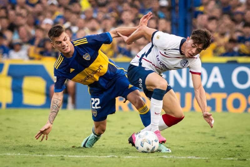 San Lorenzo's Agustin Giay and Boca Juniors' Kevin Zenon battle for ther ball during the Argentinian Professional League Cup Group B soccer match between Boca Juniors and San Lorenzo at The Alberto José Armando Stadium. Manuel Cortina/SOPA Images via ZUMA Press Wire/dpa