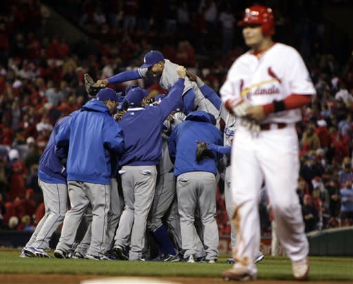 Yadier Molina of the St. Louis Cardinals walks off the field after the Dodgers sweep the 2009 NLDS.