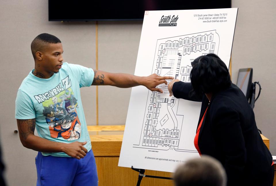 Botham Jean's neighbor Joshua Brown, left, answers questions from Assistant District Attorney LaQuita Long, right, while pointing to a map of the South Side Flats where he lived in court on Sept. 24, 2019.