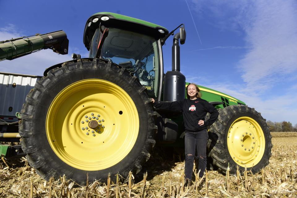 Zoe Kent pauses the 2023 grain harvest in Crawford County just long enough to pose with her tractor.