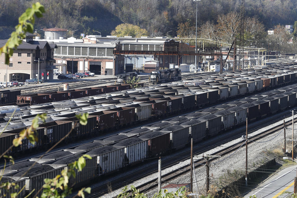 Coal cars fill a rail yard in Williamson , W.Va., Friday, Nov. 11, 2016. The hard-eyed view along the Tug Fork River in coal country is that Donald Trump has to prove he'll help Appalachian mining like he promised. (AP Photo/Steve Helber)