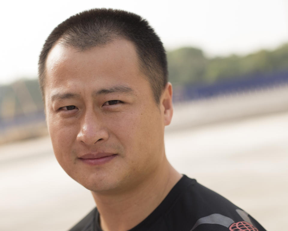 This undated photo provided by Brian Ho, shows stunt man Ju Kun on the back lot of the new Pinewood Studios in Johor Bahru, Malaysia. Ju Kun, whose credits include the acclaimed martial arts epic "The Grandmaster," was among the passengers on the Malaysia Airlines plane that disappeared early Saturday, March 8, 2014. Ju Kun was scheduled to work on the series pilot for “Marco Polo,” a joint Weinstein Co. and Netflix production, at the studio in Malaysia before he boarded the flight to return home to Beijing. (AP Photo/Brian Ho) NO SALES, NO ARCHIVES, MANDATORY CREDIT, ONE TIME USE ONLY