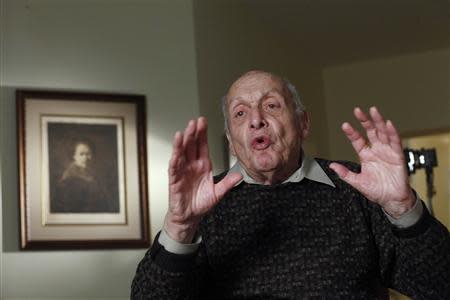 Harry Ettlinger speaks during an interview as a print of a Rembrandt self-portrait hangs on the wall in the background at his home in Rockaway, New Jersey, November 20, 2013. REUTERS/Eduardo Munoz