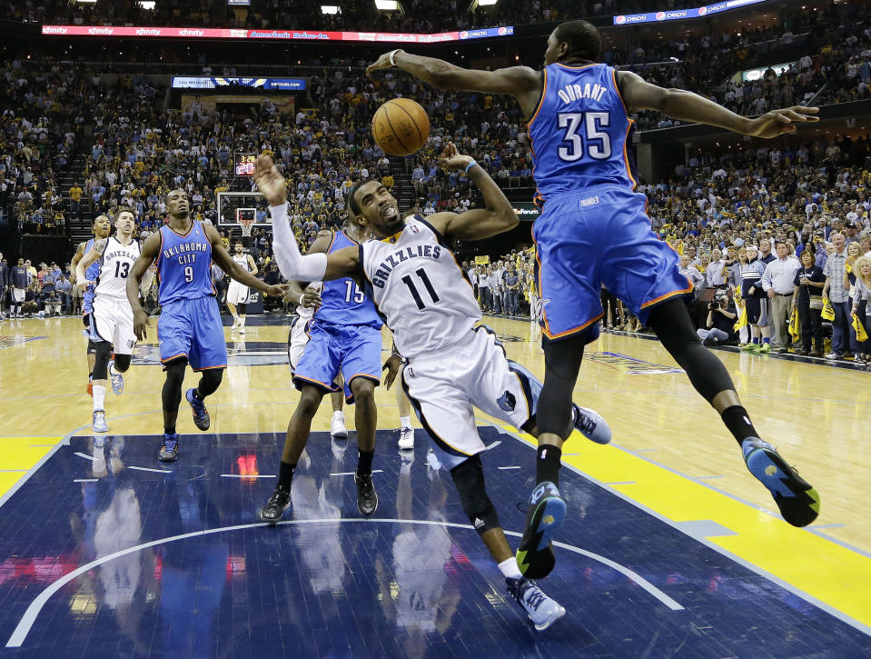 Memphis Grizzlies guard Mike Conley (11) is fouled by Oklahoma City Thunder forward Kevin Durant (35) in the second half of Game 4 of an opening-round NBA basketball playoff series Saturday, April 26, 2014, in Memphis, Tenn. Oklahoma City won in overtime 92-89. (AP Photo/Mark Humphrey)
