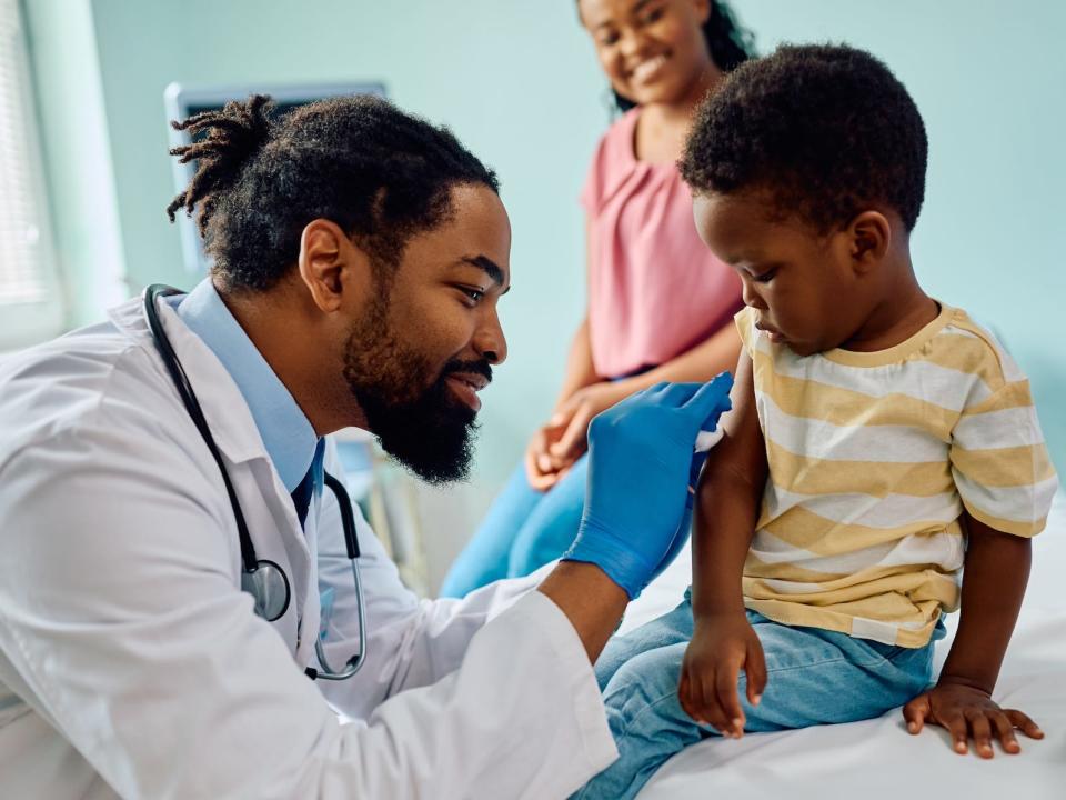 Pediatrician or doctor with a patient in a doctor's office