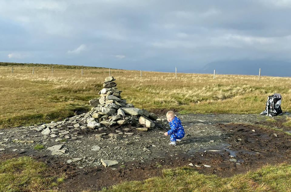 A baby was on top of the world as he tottered around a mountain summit. Little Joel Russell, 18 months, was carried up the top of Beinn Dubh, near Helensburgh, Argyll and Bute, by his dad, Kyle, 27. The tot, who has been walking since he was a year old, was given walking poles which Kyle made small enough for him to use. Dad-of-two Kyle said: "He was saying 'where are we going, where are we going?'."