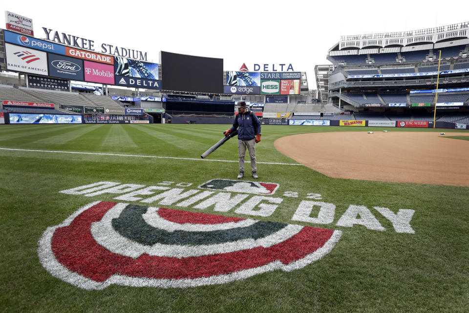 A member of the grounds crew prepares the field before the New York Yankees baseball workout on Thursday, April 7, 2022, in New York. The Yankees will face the Boston Red Sox on Friday. (AP Photo/Adam Hunger)
