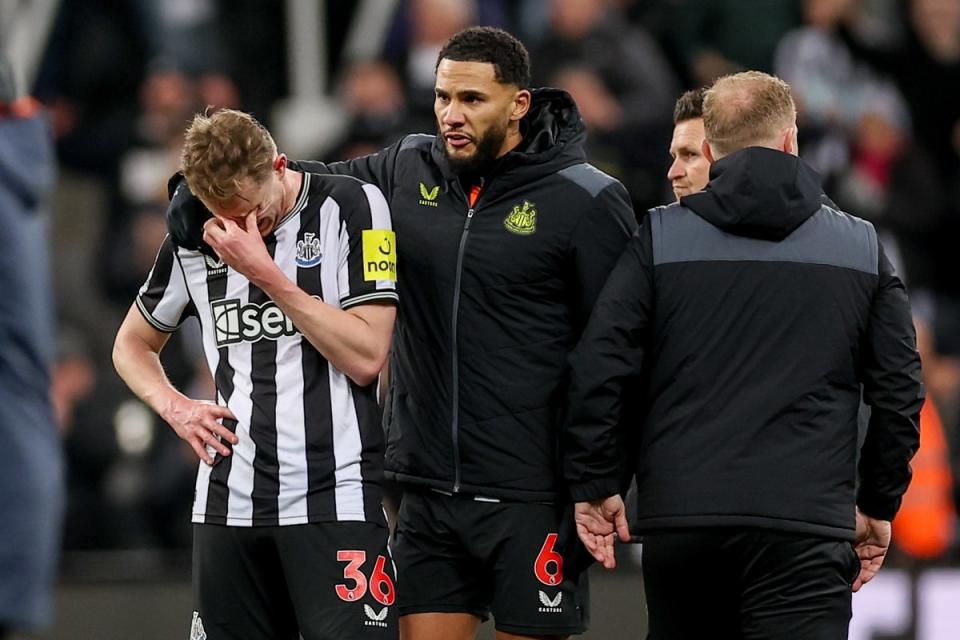 Sean Longstaff is consoled after a heatbreaking defeat by Manchester City (EPA)
