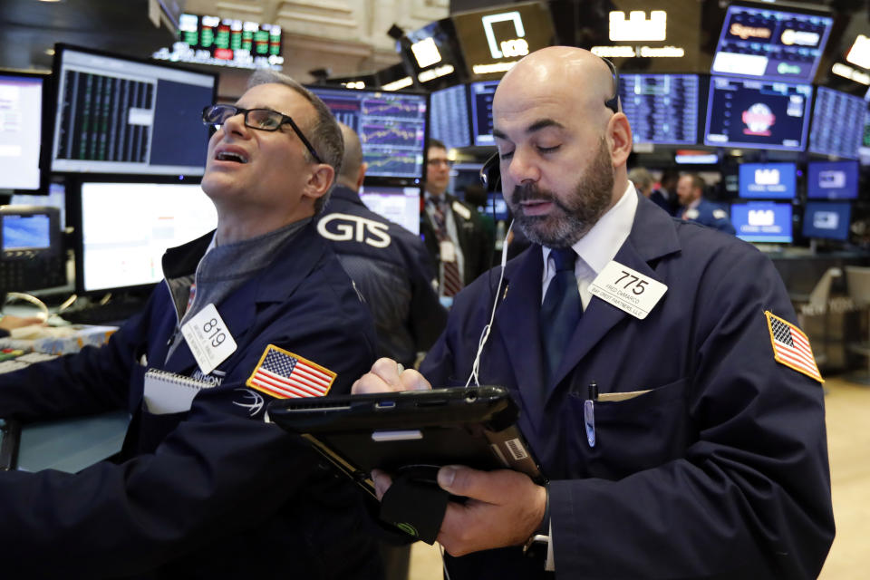 Specialist Anthony Rinaldi, left, and trader Fred DeMarco work on the floor of the New York Stock Exchange, Wednesday, Jan. 9, 2019. Stocks are opening higher on Wall Street, putting the market on track for a fourth gain in a row. (AP Photo/Richard Drew)