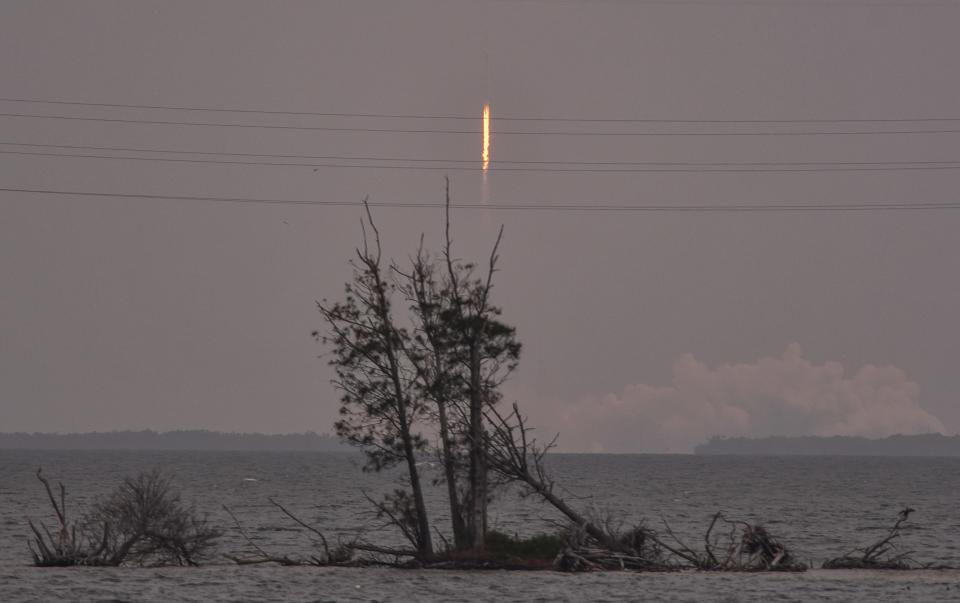 Hazy skies greatly reduced visibility of Thursday morning's SpaceX leap day launch, as viewed from State Road 528 just west of Port Canaveral.