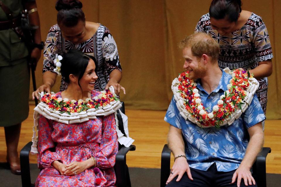 <p><strong>24 October </strong>The royal duo received floral garlands to wear during their visit.</p>