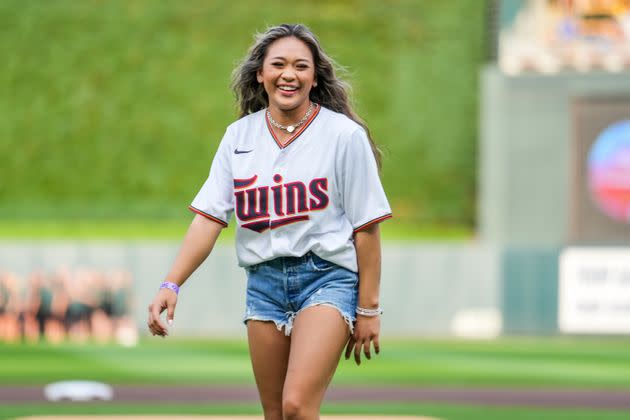 Suni Lee throws out the first pitch at a Minnesota Twins game in August. (Photo: Brace Hemmelgarn via Getty Images)