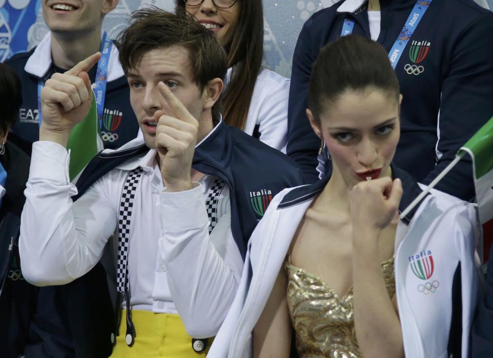 Stefania Berton and Ondrej Hotarek of Italy react in the "kiss and cry" area during the Team Pairs Short Program at the Sochi 2014 Winter Olympics, February 6, 2014. REUTERS/Darron Cummings/Pool