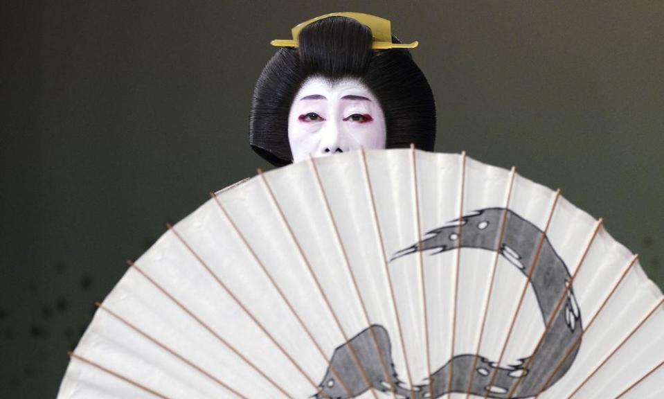 A Japanese traditional female entertainer, or geisha, from Shimbashi area performs during a run-through before their actual show of “Azumaodori” at Shimbashi Enbujo Theater Wednesday, May 22, 2019, in Tokyo. (AP Photo/Eugene Hoshiko)