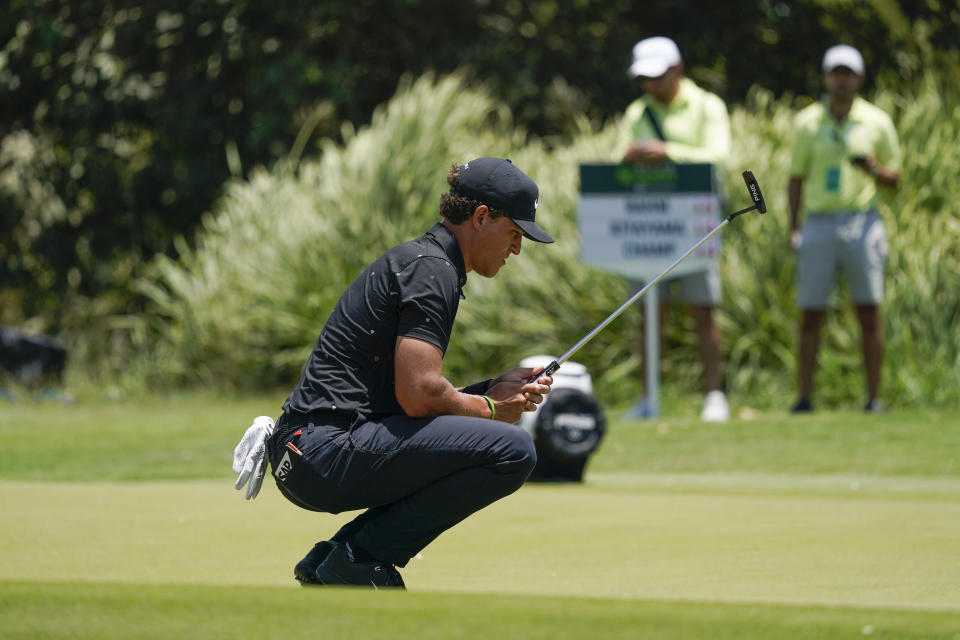 Cameron Champ, of the United States, lines up a putt on the sixth hole green during the final round of the Mexico Open at Vidanta in Puerto Vallarta, Mexico, Sunday, May 1, 2022. (AP Photo/Eduardo Verdugo)