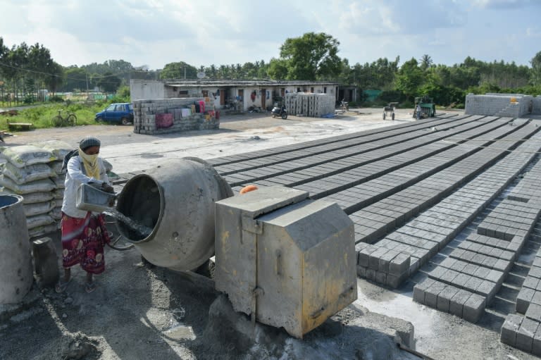 Some 14 billion cubic metres of concrete are cast every year around the globe, according to industry figures. (Manjunath KIRAN)