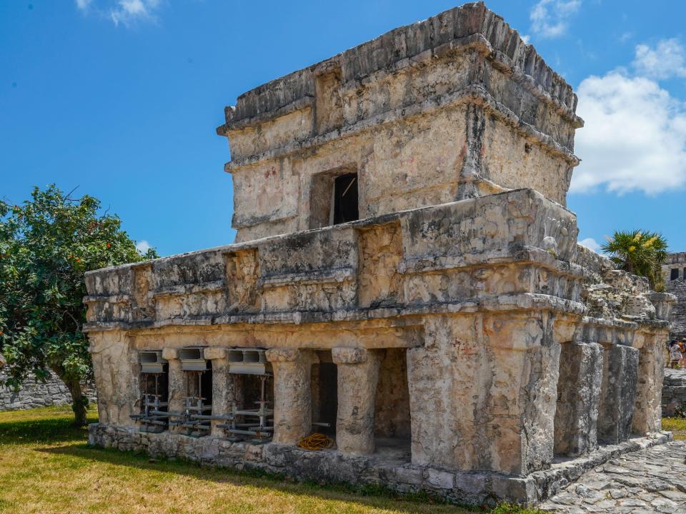 Mayan ruins in Tulum on a partly-cloudy day