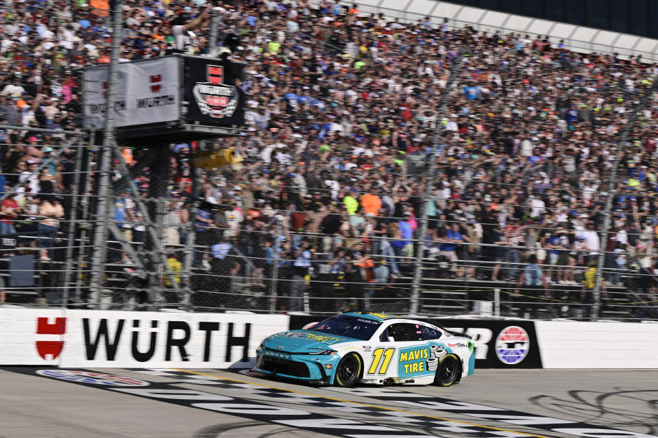 Denny Hamlin crosses the finish line to win a NASCAR Cup Series auto race at Dover Motor Speedway, Sunday, April 28, 2024, in Dover, Del. (AP Photo/Derik Hamilton)