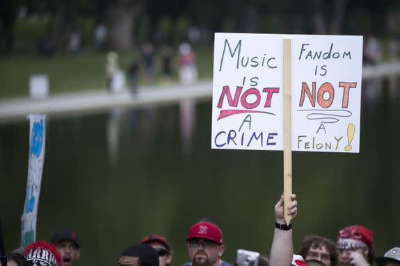 Mandatory Credit: Photo by SHAWN THEW/EPA-EFE/REX/Shutterstock (9064853e) Jaggalos, fans of the band Insane Clown Posse, listen to a speaker during the Jaggalo March at the Lincoln Memorial in Washington, DC, USA, 16 September 2017. The march is in protest to the FBI's National Gang Intelligence Center listing the Juggalos as a 'hybrid gang'. Juggalo March on the National Mall, Washington, USA - 16 Sep 2017