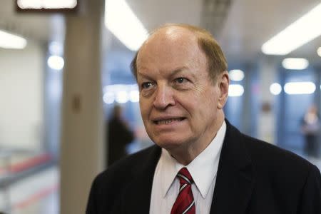 U.S. Senator Richard Shelby (R-AL) speaks to reporters as he arrives for votes on the Senate floor at the U.S. Capitol in Washington December 12, 2014. REUTERS/Jonathan Ernst