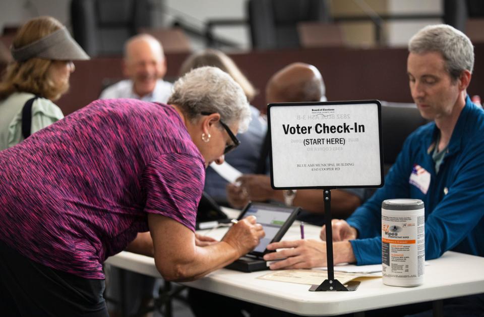 Matt Metzger, a first-time poll worker at the Blue Ash Municipal building on Aug. 2, 2022, said he "wanted to contribute to a function in democracy."