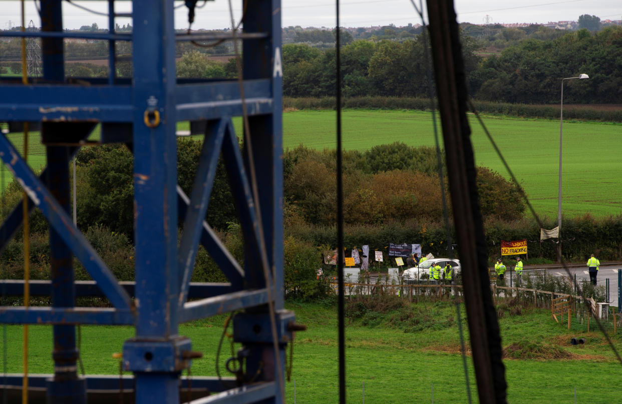 Anti-fracking protesters are seen on the edge of the site where shale gas developer Cuadrilla Resources will start fracking for gas next week at its Preston New Road site near Blackpool, Britain October 5, 2018. REUTERS/Peter Powell