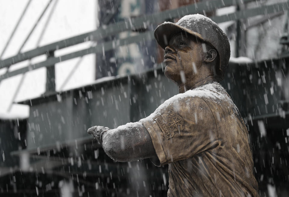 Snow falls on the statue of Seattle Mariners' legend Ken Griffey Jr., Monday, Feb. 11, 2019, in front of T-Mobile Park in Seattle. Schools were closed across Washington state as winter snowstorms continued pummeling the Northwest. Seattle's metro area has already been hit by three snowstorms in February, making it the snowiest month in Seattle in more than 30 years. (AP Photo/Ted S. Warren)