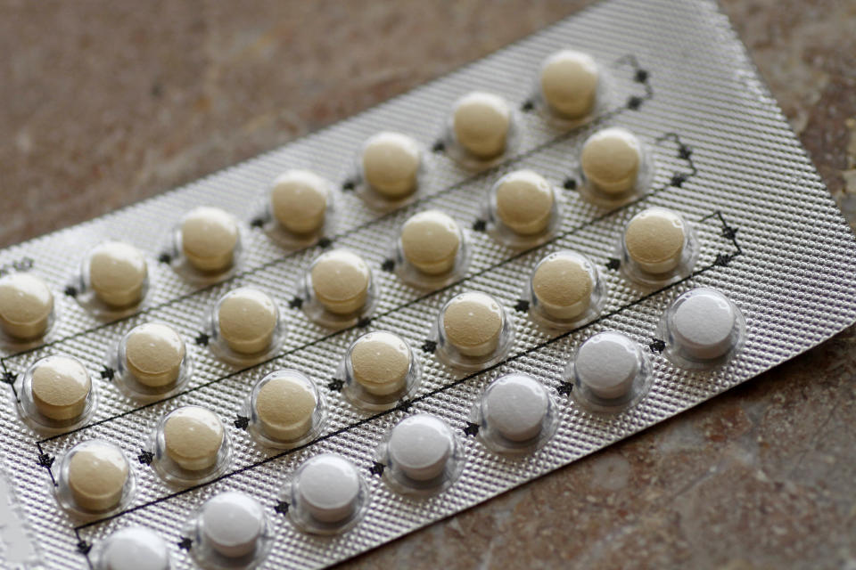 The hormones progestin and estrogen are combined in birth control pills to prevent ovulation. (Getty Images)