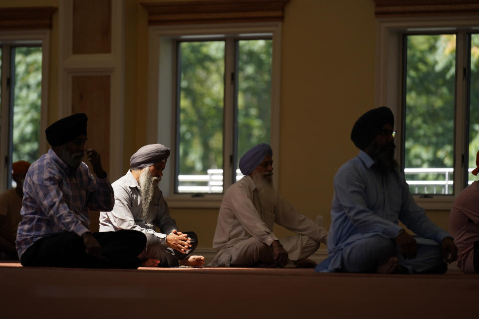 Sikhs participate in a worship service at a gurdwara in Glen Rock, N.J., Sunday, Aug. 15, 2021. (AP Photo/Seth Wenig)