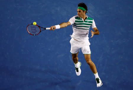 Switzerland's Roger Federer hits a shot during his semi-final match against Serbia's Novak Djokovic at the Australian Open tennis tournament at Melbourne Park, Australia, January 28, 2016. REUTERS/Jason Reed