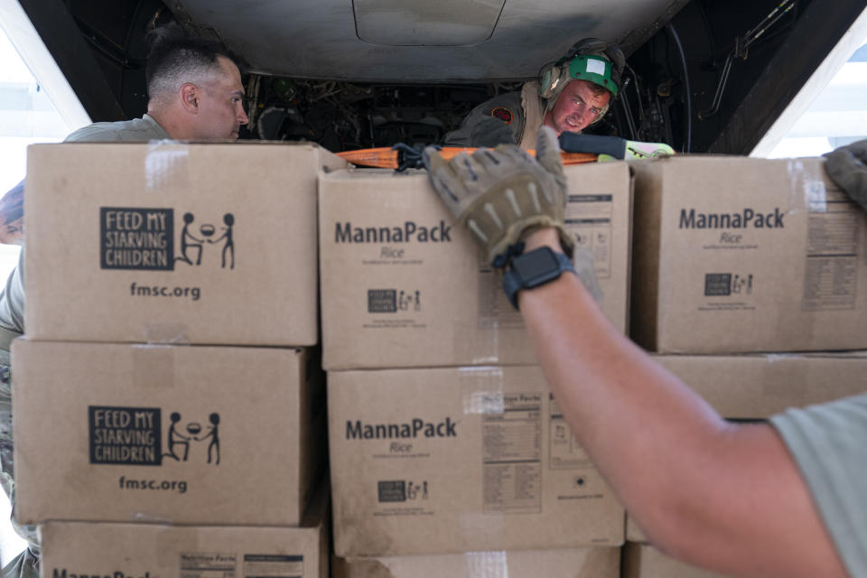 Food is loaded onto a VM-22 Osprey at Toussaint Louverture International Airport, Saturday, Aug. 28, 2021, in Port-au-Prince, Haiti. The VMM-266, "Fighting Griffins," from Marine Corps Air Station New River, from Jacksonville, N.C., are flying in support of Joint Task Force Haiti after a 7.2 magnitude earthquake on Aug. 22, caused heavy damage to the country. (AP Photo/Alex Brandon)