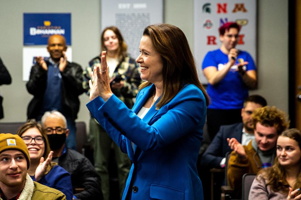 1st Congressional District candidate state Rep. Christina Bohannan, D-Iowa City, waves while being introduced during a "Get Out The Vote" rally with the University of Iowa Democrats on Wednesday at the Iowa Memorial Union.