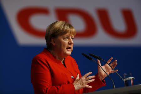 German Chancellor and leader of the conservative Christian Democratic Union party CDU Angela Merkel addresses the CDU party convention in Essen, Germany, December 6, 2016. REUTERS/Wolfgang Rattay