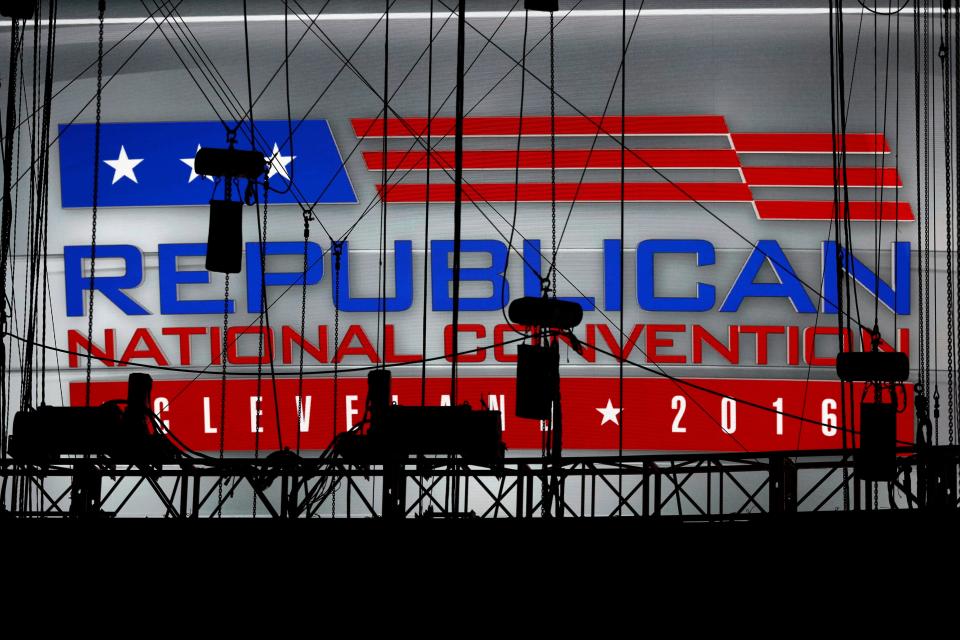 A convention logo is seen over the stage as preparations take place inside Quicken Loans Arena for the Republican National Convention, Sunday, July 17, 2016, in Cleveland.