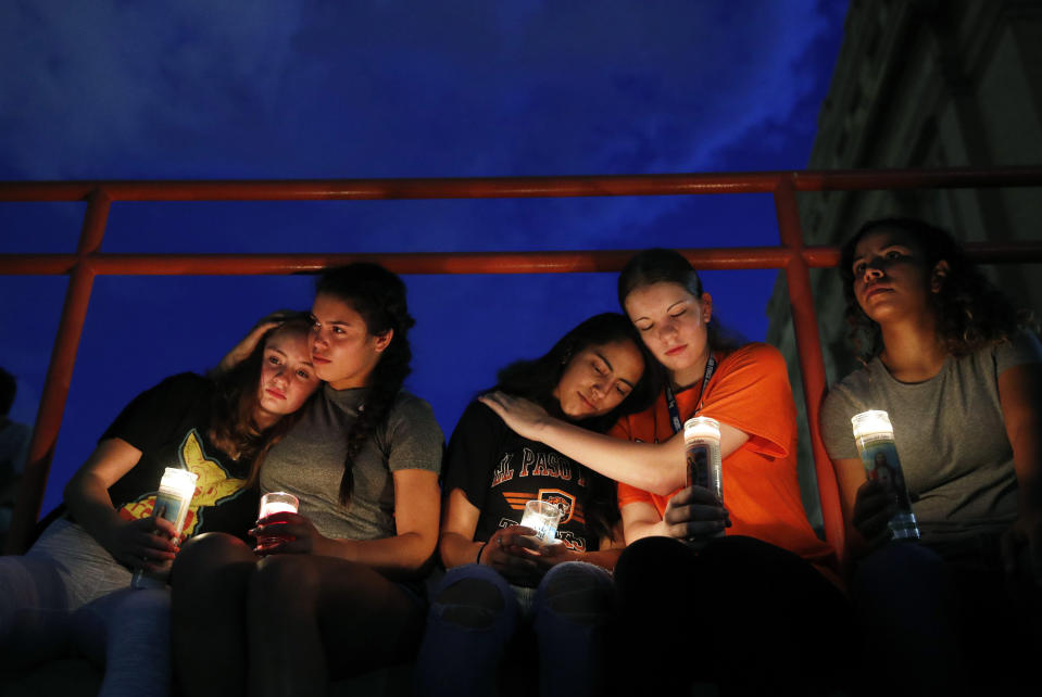 From left, Melody Stout, Hannah Payan, Aaliyah Alba, Sherie Gramlich and Laura Barrios comfort each other during a vigil for victims of the shooting Aug. 3, 2019, in El Paso, Texas. A young gunman opened fire in an El Paso, Texas, shopping area during the busy back-to-school season, leaving multiple people dead and more than two dozen injured. (Photo: John Locher/AP)