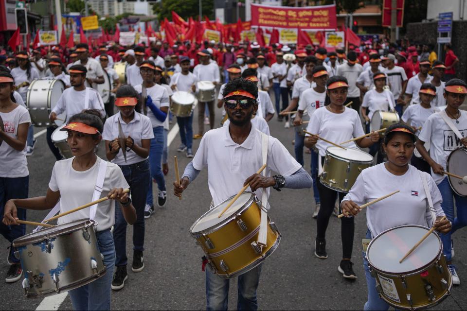 Members of the People's Liberation Front, a marxist political party, beat drums as they participate in a rally to mark May Day in Colombo, Sri Lanka, Monday, May 1, 2023. (AP Photo/Eranga Jayawardena)