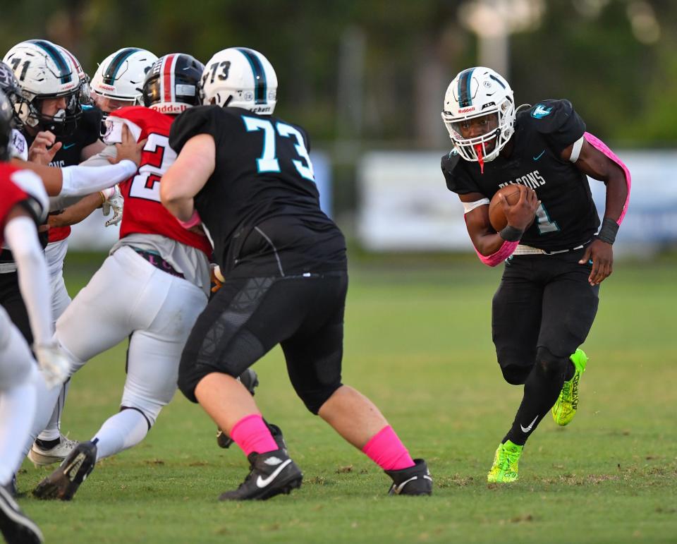 Jensen Beach running back Dennis Palmer Jr. (1) breaks a run in a high school football game against South Fork on Monday, Oct. 16, 2023, in Jensen Beach.